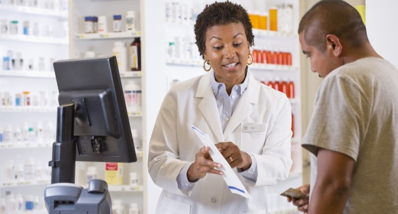 Pharmacist helping customer